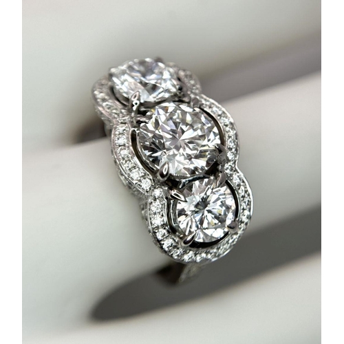 289 - A Head-Turning 18K White Gold and Lab Diamond Dress Ring. Three remarkable VS1 brilliant round cut d... 