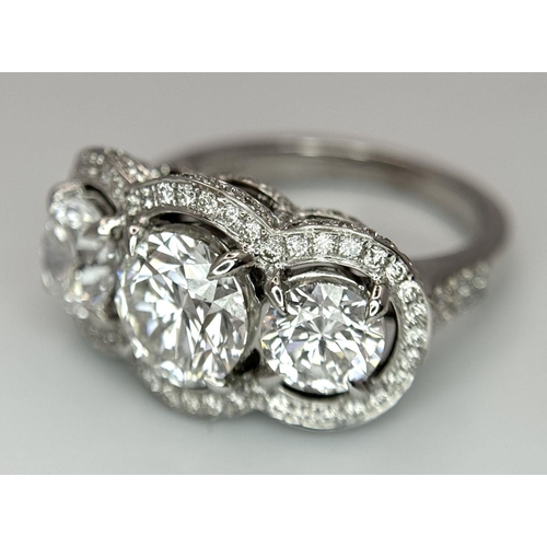 289 - A Head-Turning 18K White Gold and Lab Diamond Dress Ring. Three remarkable VS1 brilliant round cut d... 