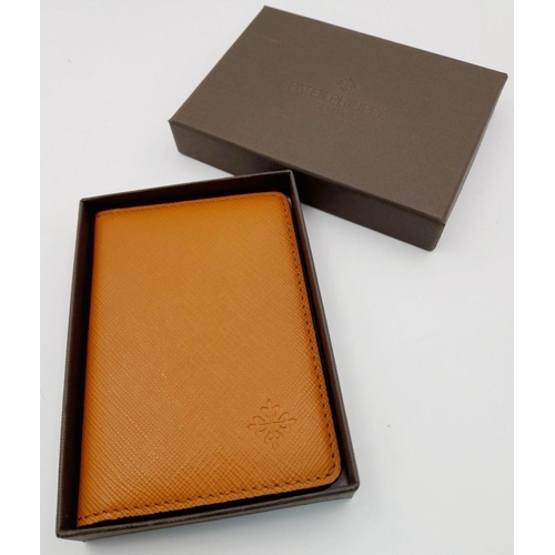 327 - An Unused Tan Leather Card and Money Wallet by the Renown Watch Maker Patek Philippe. 8 x11.5cm Fold... 