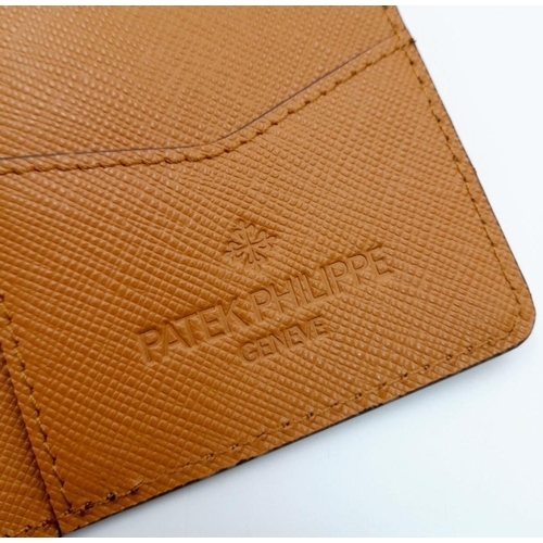 327 - An Unused Tan Leather Card and Money Wallet by the Renown Watch Maker Patek Philippe. 8 x11.5cm Fold... 