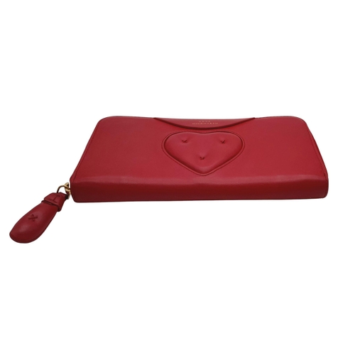 378 - An Anya Hindmarch Clutch Purse/Wallet. Red leather exterior with quilted heart. Zipped and open comp... 