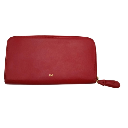 378 - An Anya Hindmarch Clutch Purse/Wallet. Red leather exterior with quilted heart. Zipped and open comp... 