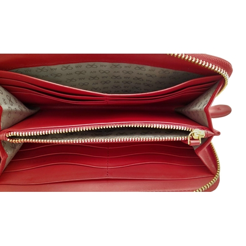 378 - An Anya Hindmarch Clutch Purse/Wallet. Red leather exterior with quilted heart. Zipped and open comp... 