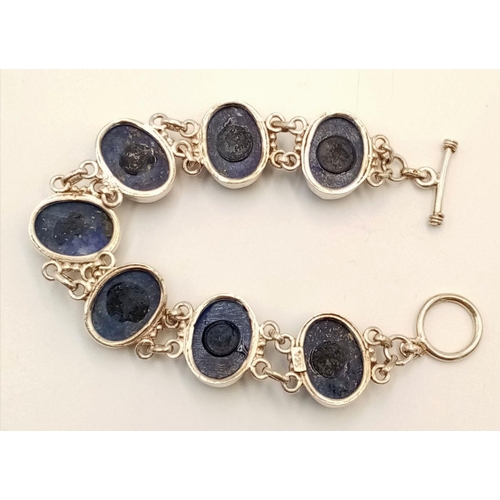 585 - A Vintage Sterling Silver, Lapis Lazuli Cabochon, T-Bar Bracelet. 19cm Length, Set with seven 1.5cm ... 