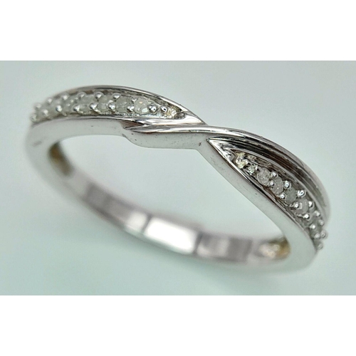 838 - A Sterling Silver Diamond Set Cross Over Design Ring Size P1/2. Ring Measures 5mm Wide at its widest... 