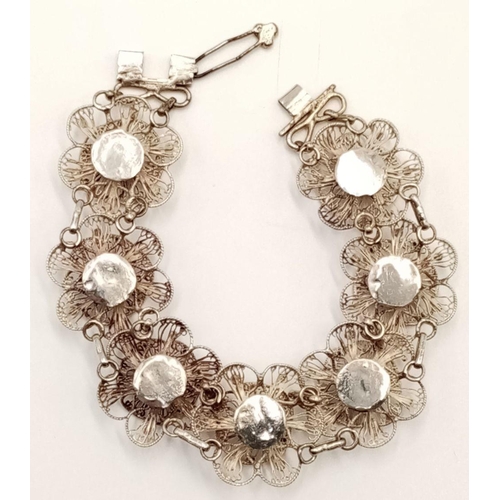 873 - A Vintage or Older Silver Filigree Flower Design Bracelet-17cm Length. 13.65 Grams.