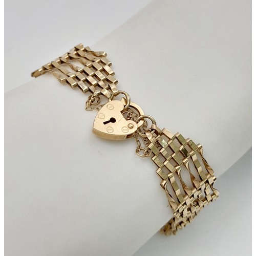 348 - A 9K yellow gold gate bracelet, 6.6g total weight, 18cm total length. Ref SH1719I