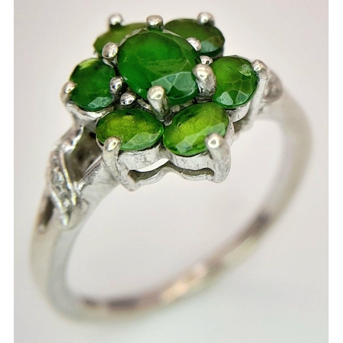 1055 - A Sterling Silver Green Garnet and Diamond Set Ring Size P. The Ring Measures 1.2cm Wide at the Crow... 