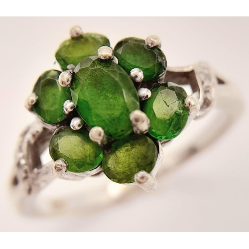 1055 - A Sterling Silver Green Garnet and Diamond Set Ring Size P. The Ring Measures 1.2cm Wide at the Crow... 