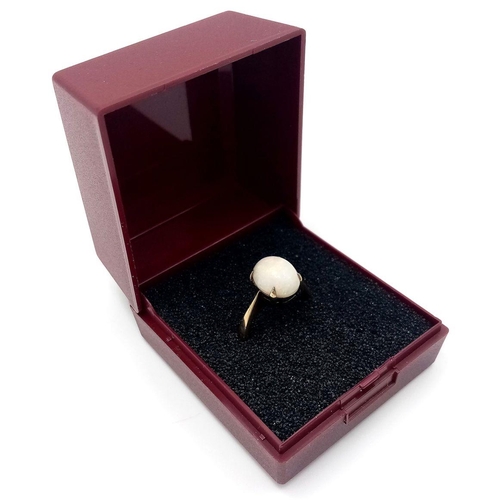 146 - Stunning 9 carat GOLD and FIRE OPAL CABOCHON RING. complete with ring box. 2.48 grams. Size J.