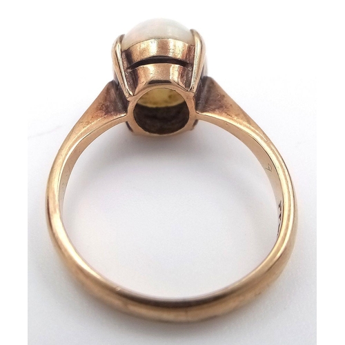 146 - Stunning 9 carat GOLD and FIRE OPAL CABOCHON RING. complete with ring box. 2.48 grams. Size J.