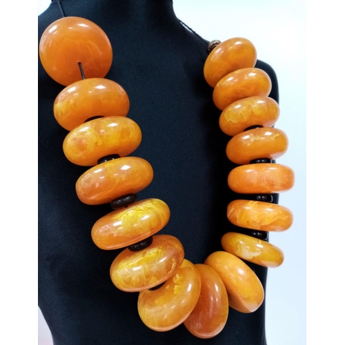 1496 - A Large Yellow Berber Resin Necklace. 905g total weight.