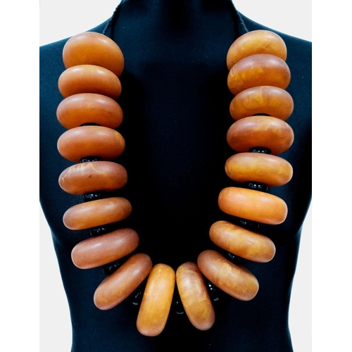 1559 - A Large Berber Amber Resin Necklace. 1074g total weight.