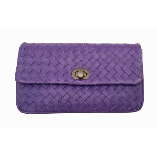 164 - A Bottega Venetta Purple Leather Pouch. Soft quilted leather with a brushed metal clasp. Soft textil... 