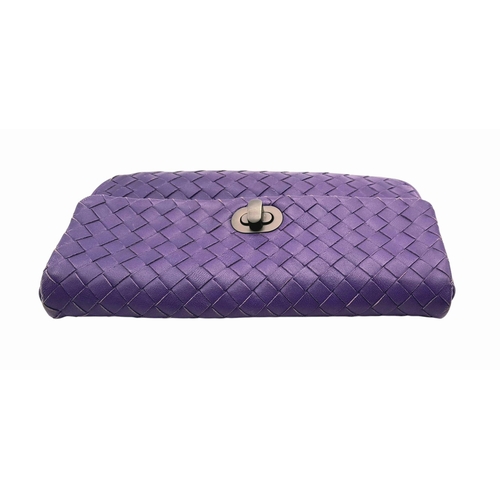 164 - A Bottega Venetta Purple Leather Pouch. Soft quilted leather with a brushed metal clasp. Soft textil... 