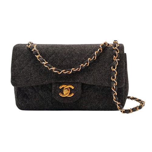 18 - A Chanel Grey Wool Small Double Flap Bag. Grey wool exterior with gold-toned hardware, featuring cha... 