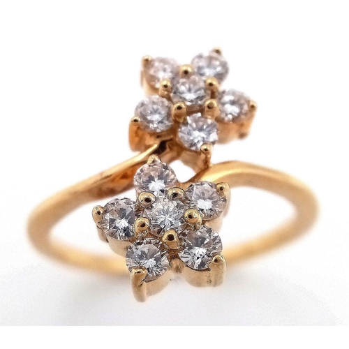 184 - A 14K YELLOW GOLD DOUBLE FLOWER CLUSTER TWIST DIAMOND RING, 0.50CT DIAMONDS APPROX, 3.6G SIZE L. Ref... 