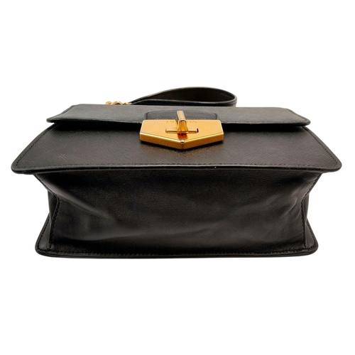 255 - A Prada Black Shoulder Bag. Saffiano leather exterior with gold-toned hardware, chain and leather st... 