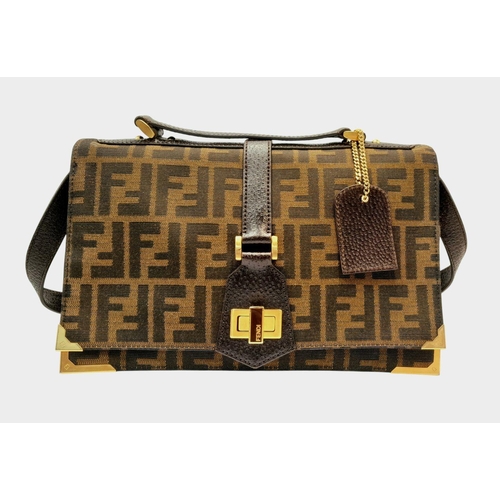 269 - A Fendi Zucca Print Bag. Canvas and leather exterior with gold-toned hardware and twist-lock closure... 