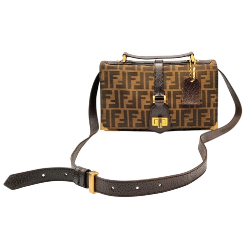 269 - A Fendi Zucca Print Bag. Canvas and leather exterior with gold-toned hardware and twist-lock closure... 