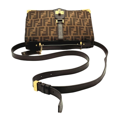 269 - A Fendi Zucca Print Bag. Canvas and leather exterior with gold-toned hardware and twist-lock closure... 