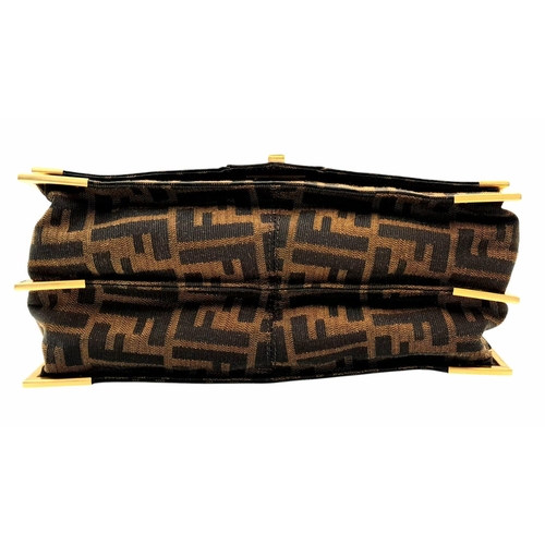 269 - A Fendi Zucca Print Bag. Canvas and leather exterior with gold-toned hardware and twist-lock closure... 