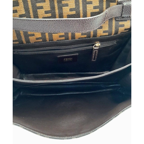 269 - A Fendi Zucca Print Bag. Canvas and leather exterior with gold-toned hardware and twist-lock closure... 