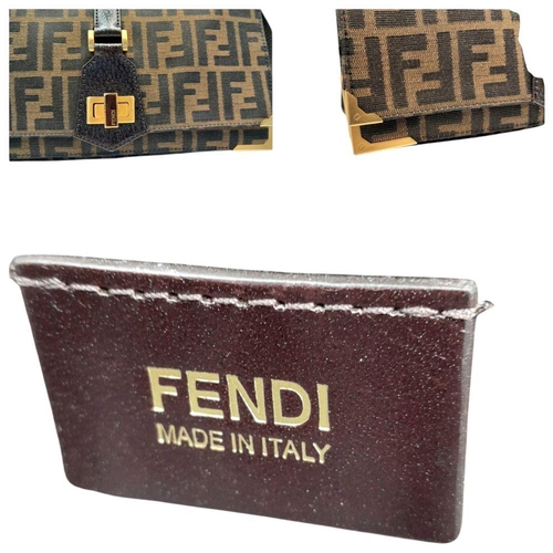 269 - A Fendi Zucca Print Bag. Canvas and leather exterior with gold-toned hardware and twist-lock closure... 