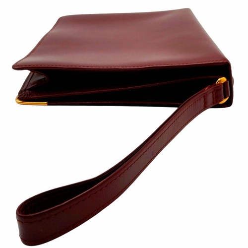 305 - A Cartier Burgundy Must de Cartier Wallet. Burgundy leather exterior, featuring gold-toned hardware ... 