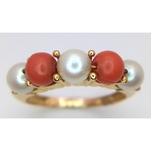 355 - A 18K yellow gold pearl and coral ring, pearl size 3x5mm, coral size 2x5mm, 4.7g total weight, size ... 