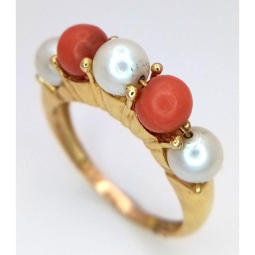 355 - A 18K yellow gold pearl and coral ring, pearl size 3x5mm, coral size 2x5mm, 4.7g total weight, size ... 