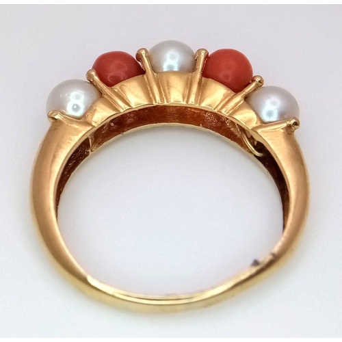 355 - A 18K yellow gold pearl and coral ring, pearl size 3x5mm, coral size 2x5mm, 4.7g total weight, size ... 