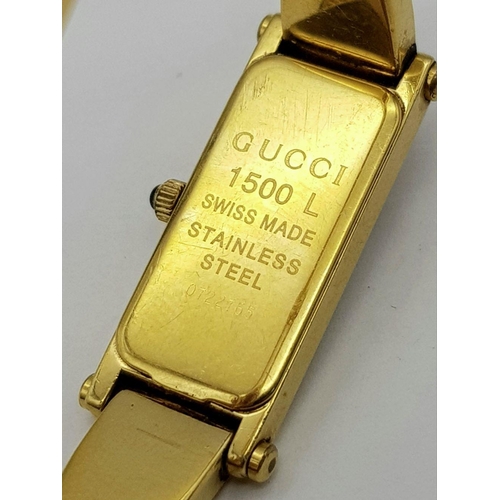 396 - A Gucci Gold Plated Ladies Quartz Watch. Gold plated bracelet and case - 12mm width. Mother of pearl... 