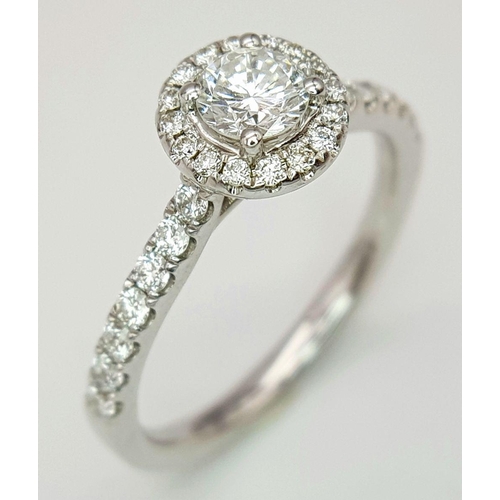 40 - AN 18K WHITE GOLD DIAMOND HALO SOLITAIRE RING, 0.30CT MAIN ROUND BRILLIANT CUT CENTRE STONE, WITH 0.... 