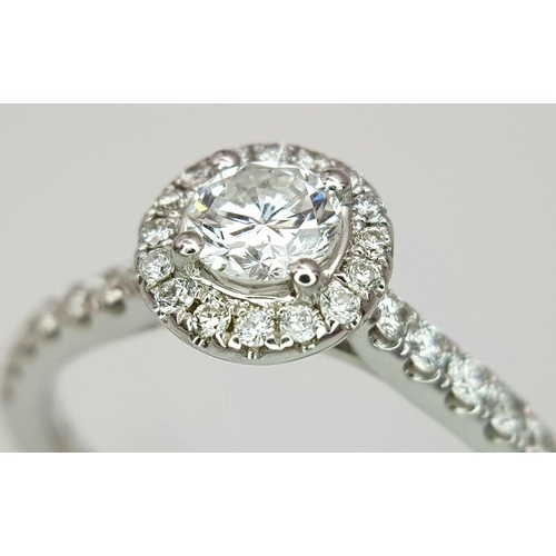 40 - AN 18K WHITE GOLD DIAMOND HALO SOLITAIRE RING, 0.30CT MAIN ROUND BRILLIANT CUT CENTRE STONE, WITH 0.... 