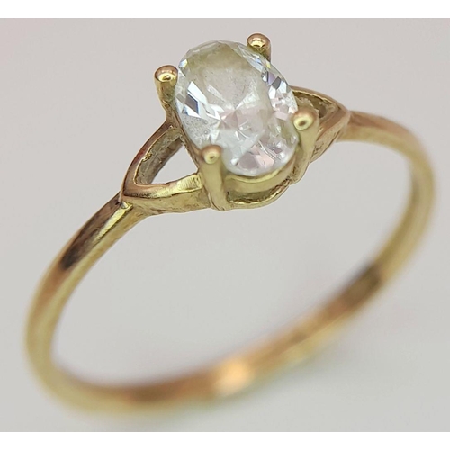 435 - Dainty 9 carat GOLD RING. Having oval cut AQUA GEMSTONE set to top. 0.98 grams. Size L 1/2 - M.