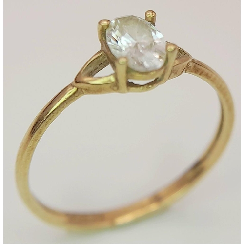 435 - Dainty 9 carat GOLD RING. Having oval cut AQUA GEMSTONE set to top. 0.98 grams. Size L 1/2 - M.