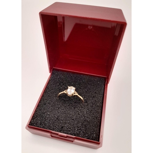 435 - Dainty 9 carat GOLD RING. Having oval cut AQUA GEMSTONE set to top. 0.98 grams. Size L 1/2 - M.