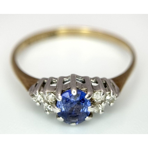 579 - A 9K yellow gold diamond and sapphire ring, 0.10ct diamond weight, 0.35ct sapphire weight, size K 1/... 