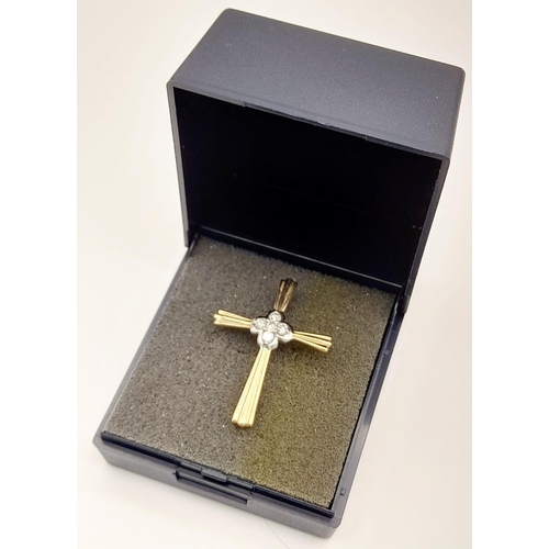 91 - Beautiful 9 carat GOLD and DIAMOND CROSS. Consisting YELLOW GOLD CROSS with WHITE GOLD centre set wi... 