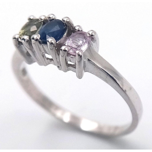 929 - A Sterling Silver Blue, Pink & Green Sapphire Trilogy Ring Size P1/2. Set with three 5mm Length Oval... 