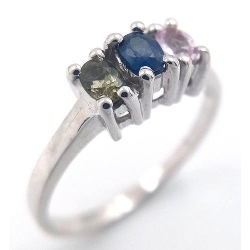 929 - A Sterling Silver Blue, Pink & Green Sapphire Trilogy Ring Size P1/2. Set with three 5mm Length Oval... 