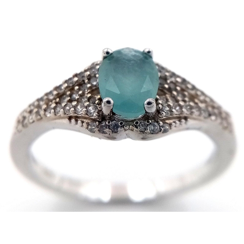 935 - Sterling Silver Aquamarine and White Sapphire Set Ring Size S. The Ring is set with a 7mm Oval Cut A... 