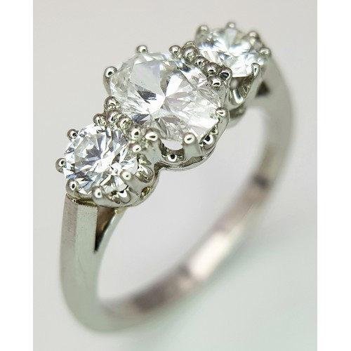 5 - A PLATINUM DIAMOND 3 STONE RING, OVAL CENTRE 0.75CT DIAMOND, WITH A 0.33CT ROUND BRILIANT CUT DIAMON... 