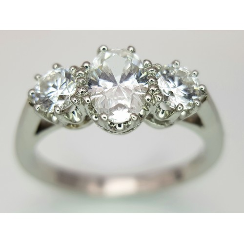 5 - A PLATINUM DIAMOND 3 STONE RING, OVAL CENTRE 0.75CT DIAMOND, WITH A 0.33CT ROUND BRILIANT CUT DIAMON... 