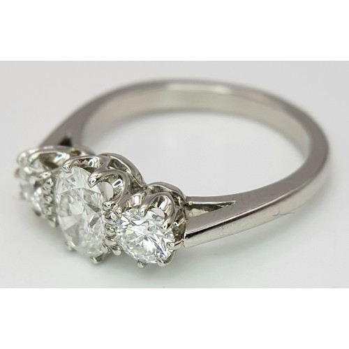 5 - A PLATINUM DIAMOND 3 STONE RING, OVAL CENTRE 0.75CT DIAMOND, WITH A 0.33CT ROUND BRILIANT CUT DIAMON... 