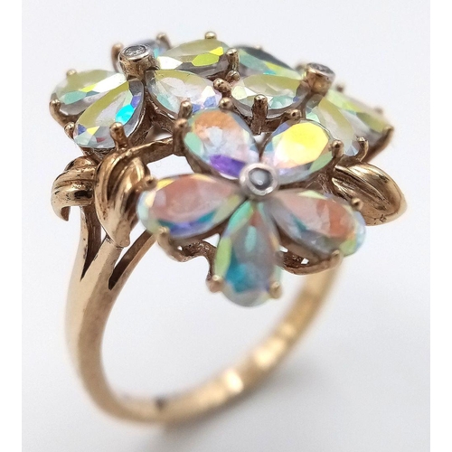 118 - A stunning 9 CARAT GOLD, MYSTIC TOPAZ RING. Having Mystic Topaz Gemstones set in flower formation wi... 