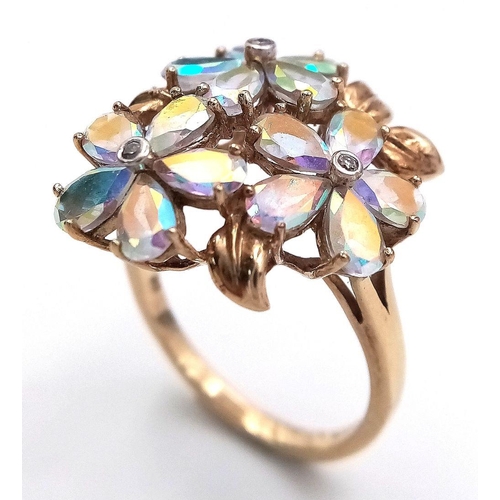 118 - A stunning 9 CARAT GOLD, MYSTIC TOPAZ RING. Having Mystic Topaz Gemstones set in flower formation wi... 