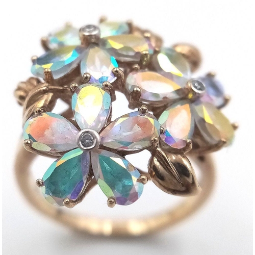 118 - A stunning 9 CARAT GOLD, MYSTIC TOPAZ RING. Having Mystic Topaz Gemstones set in flower formation wi... 