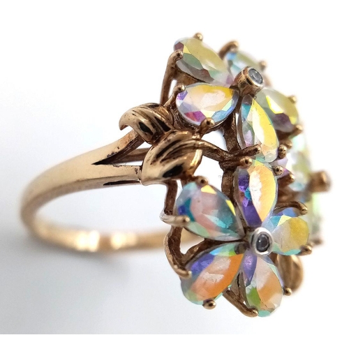 118 - A stunning 9 CARAT GOLD, MYSTIC TOPAZ RING. Having Mystic Topaz Gemstones set in flower formation wi... 